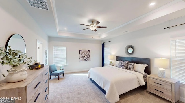 bedroom featuring visible vents, a ceiling fan, light colored carpet, a tray ceiling, and recessed lighting