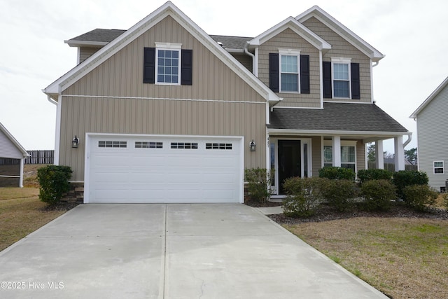 view of front of house featuring a garage, board and batten siding, roof with shingles, and concrete driveway