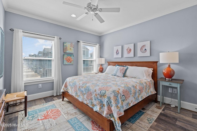 bedroom with ceiling fan, baseboards, wood finished floors, and crown molding