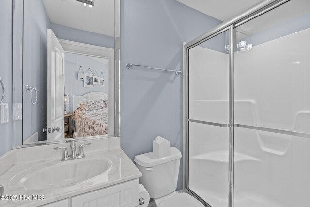 bedroom with ceiling fan, wood finished floors, baseboards, and ornamental molding