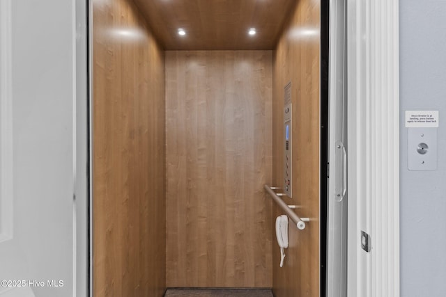 room details featuring elevator and recessed lighting