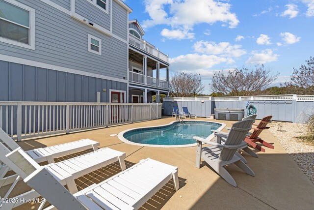 view of pool featuring a fenced in pool and a patio