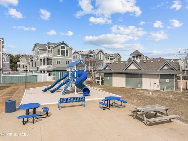 community jungle gym with a residential view