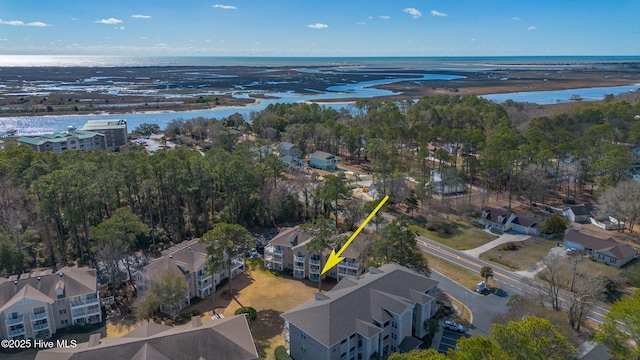 birds eye view of property featuring a water view and a residential view