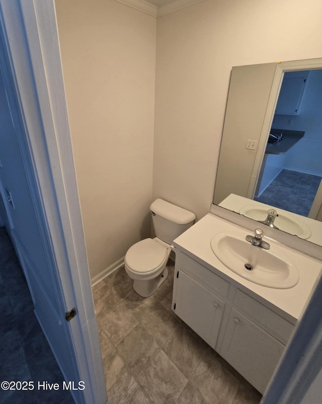 bathroom featuring toilet and vanity