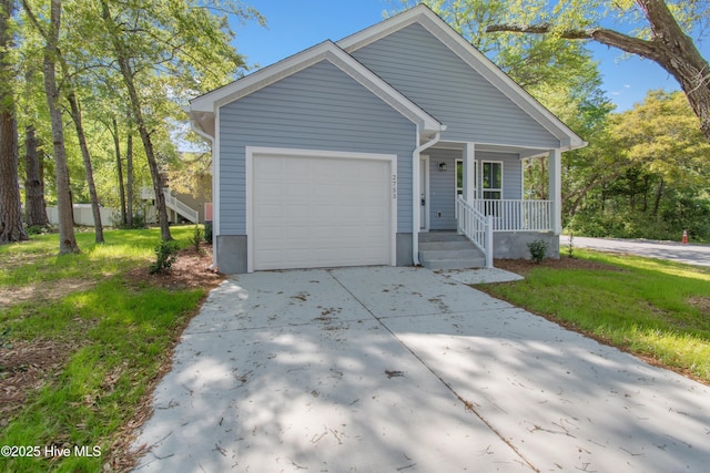 view of front facade with concrete driveway, a garage, and covered porch