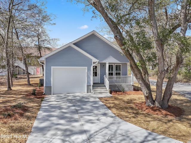 view of front of house featuring a garage, a porch, and concrete driveway