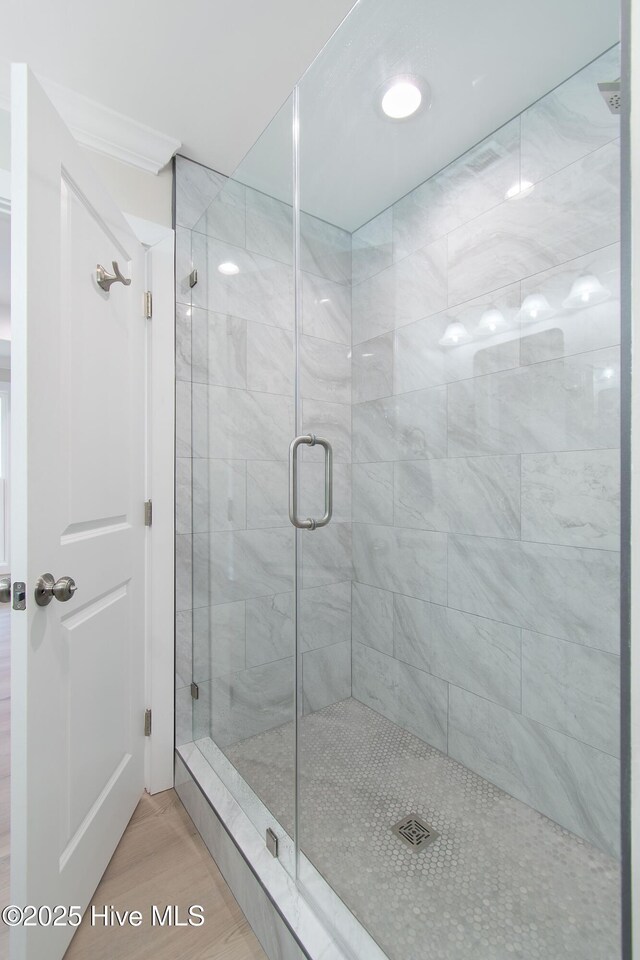mudroom featuring baseboards, ornamental molding, and wood finished floors