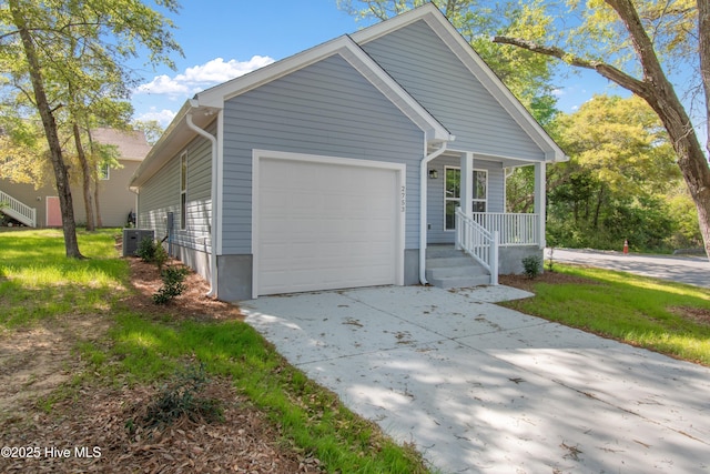 view of front of home featuring an attached garage, driveway, and covered porch