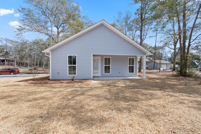 rear view of house with a porch