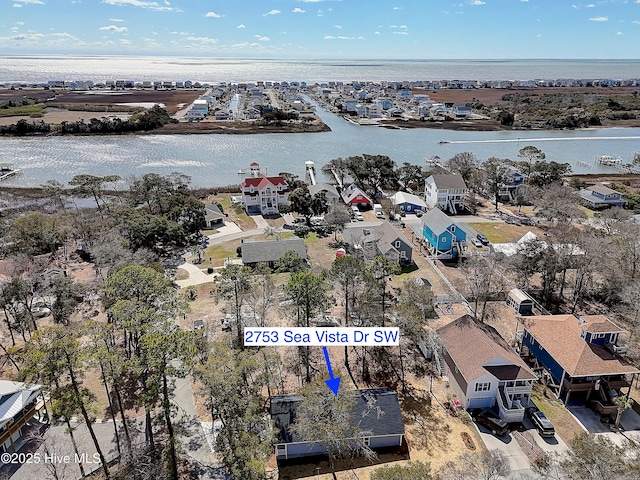 drone / aerial view with a water view