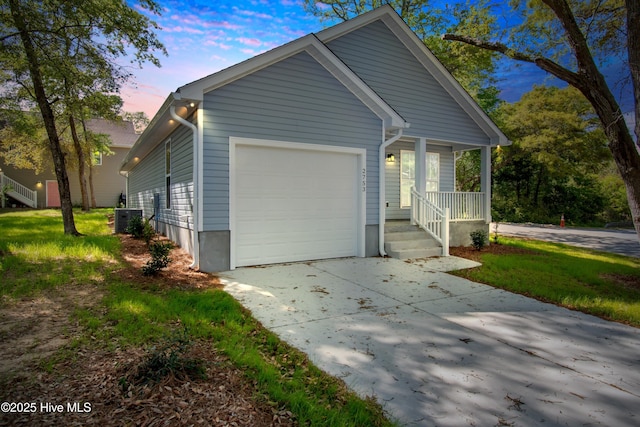 view of yard featuring driveway and a balcony