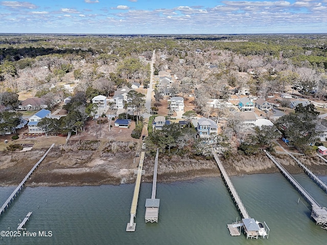 drone / aerial view with a residential view and a water view