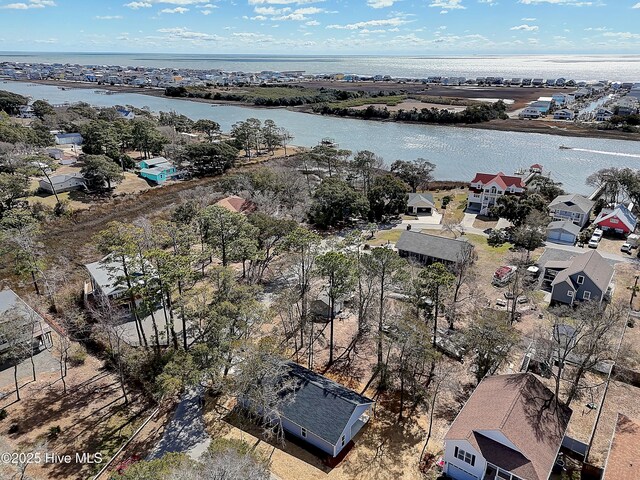 birds eye view of property with a residential view and a water view