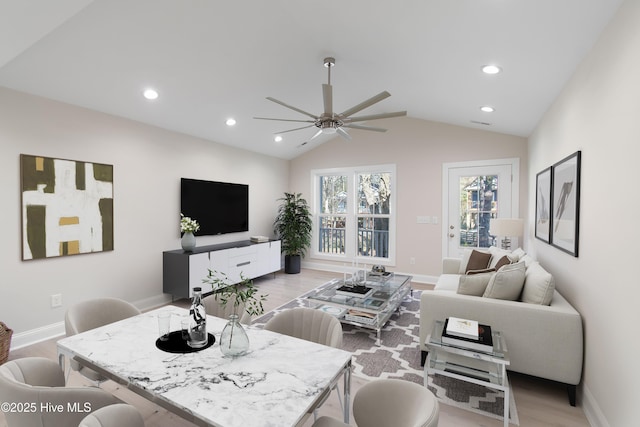 living area featuring recessed lighting, light wood-style floors, and lofted ceiling