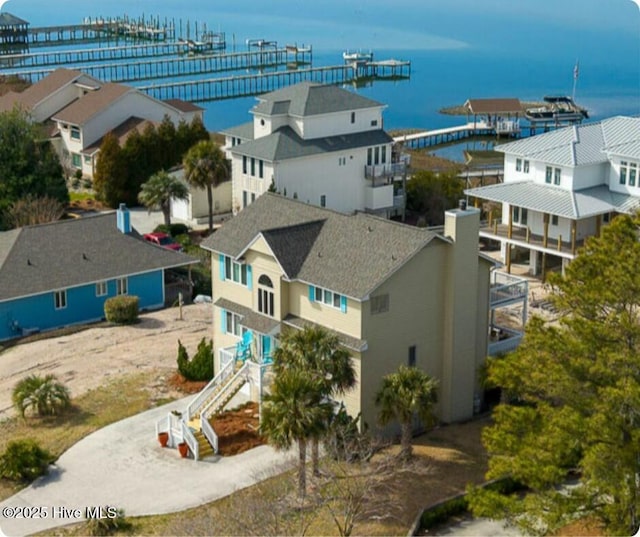 birds eye view of property with a residential view and a water view