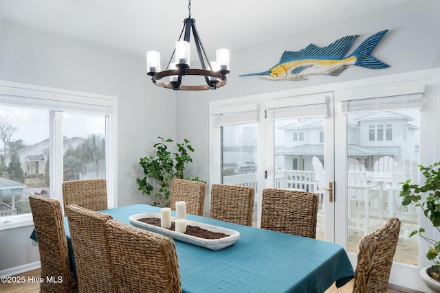 dining area featuring a notable chandelier