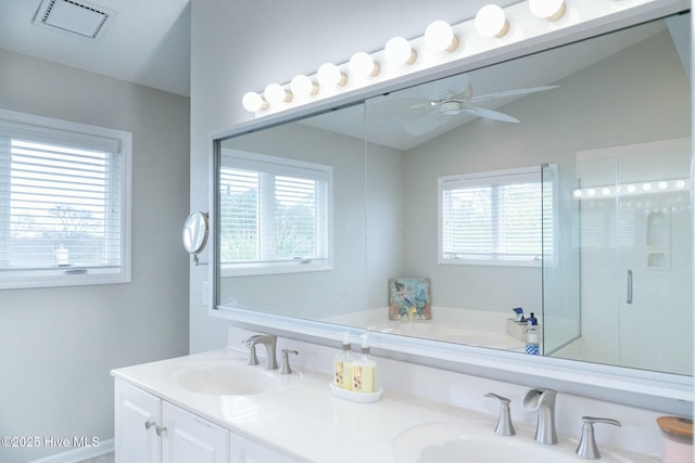 bathroom with a sink, double vanity, ceiling fan, and a shower stall