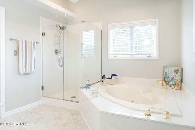 bathroom with a stall shower, a whirlpool tub, and tile patterned flooring