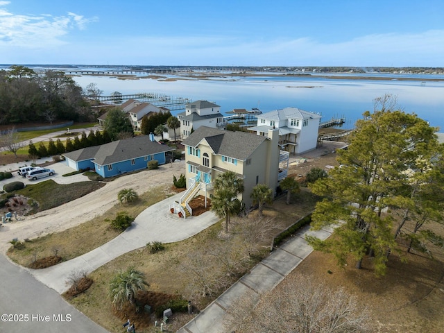 aerial view with a water view and a residential view