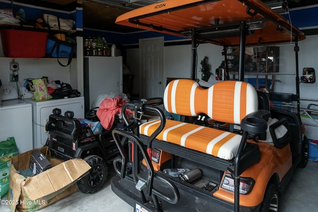 garage featuring washer and clothes dryer