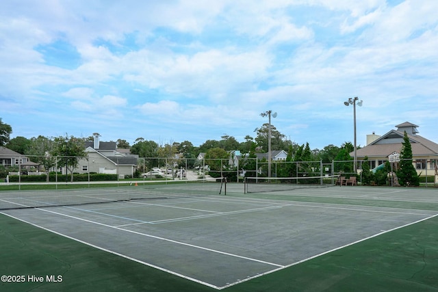 view of sport court with fence