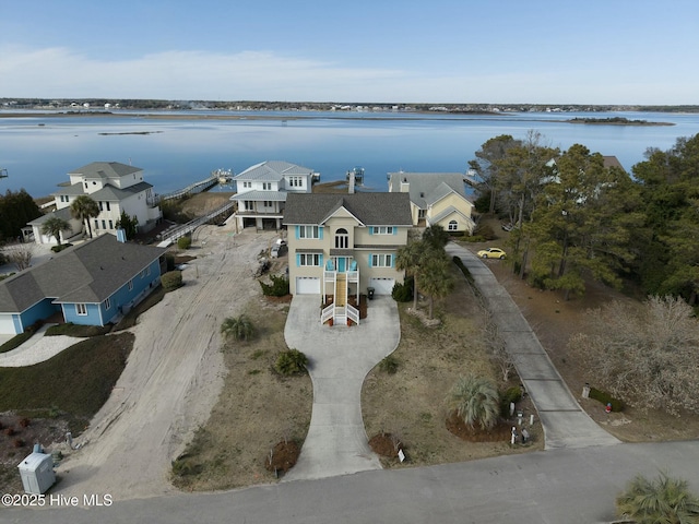 birds eye view of property with a residential view and a water view