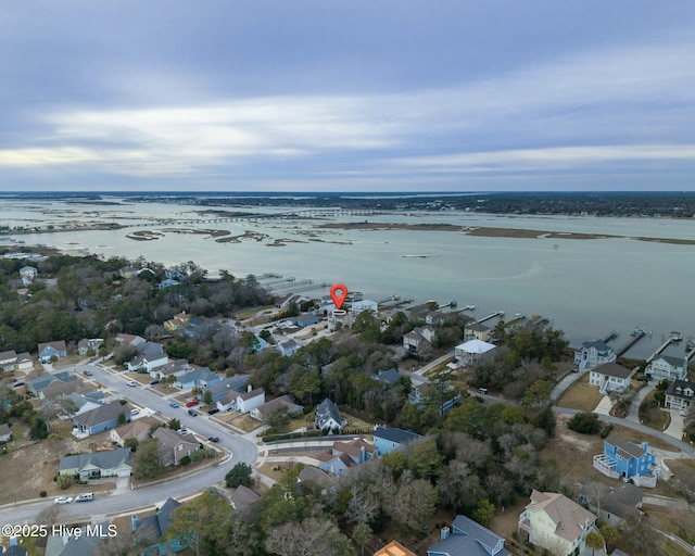 bird's eye view featuring a residential view and a water view