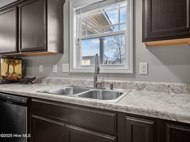 kitchen with a sink, dark brown cabinetry, dishwasher, and light countertops