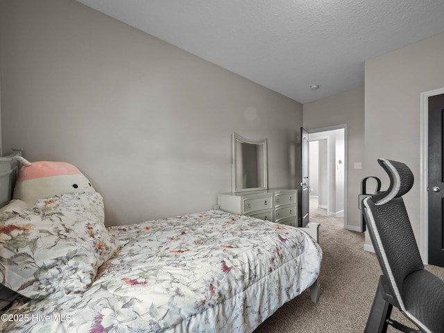 bedroom featuring baseboards, light colored carpet, and a textured ceiling