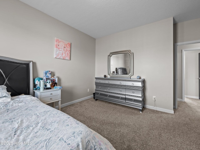 bedroom with baseboards and carpet floors