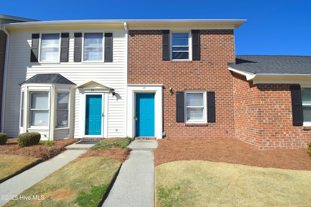 view of front of home with brick siding