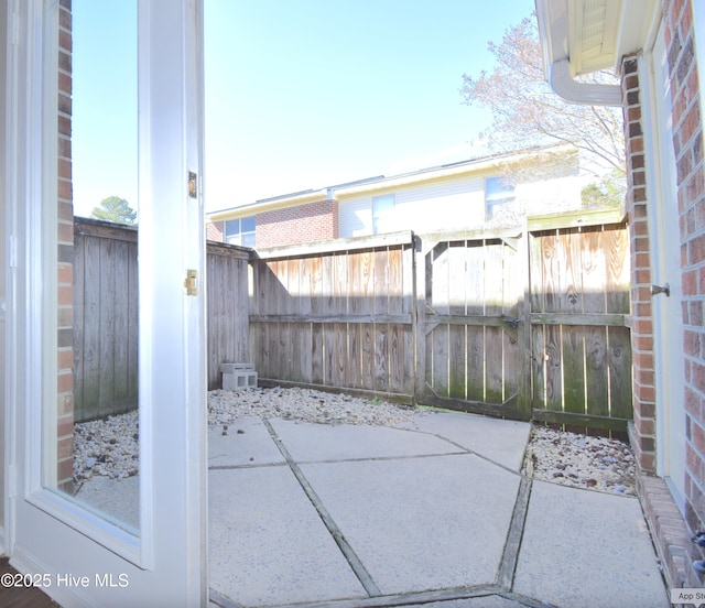 view of patio featuring fence