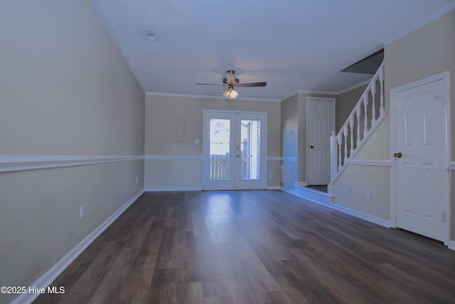 entrance foyer with french doors, dark wood-style flooring, stairs, and crown molding