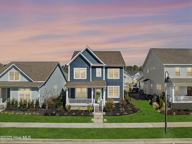 view of front of home featuring a porch and a front yard