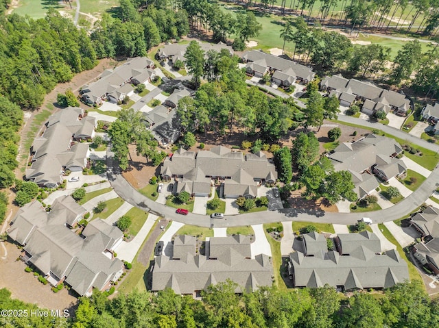 birds eye view of property with a residential view