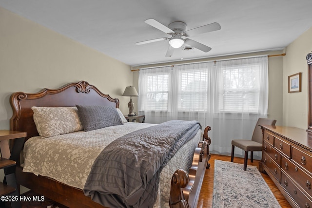 bedroom featuring a ceiling fan and wood finished floors