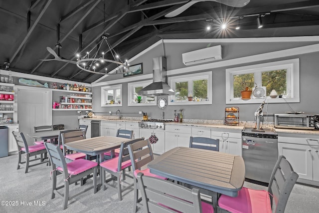 kitchen featuring lofted ceiling, a toaster, white cabinets, a wall mounted air conditioner, and island range hood