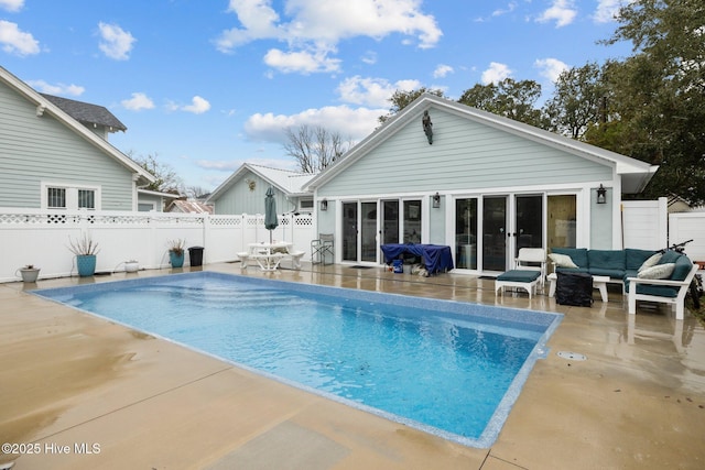 view of swimming pool with a fenced in pool, an outdoor hangout area, a fenced backyard, and a patio area