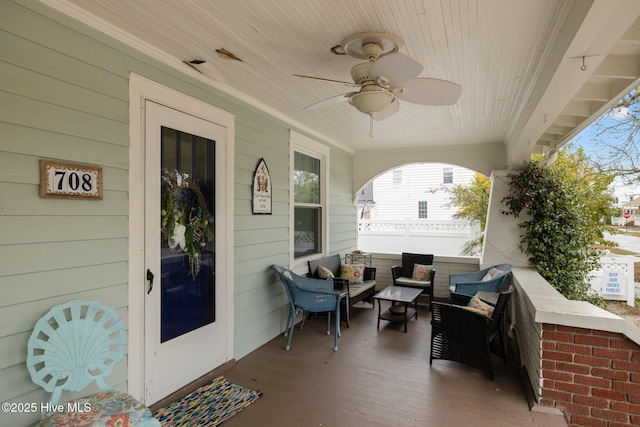 view of patio / terrace featuring a porch, an outdoor hangout area, and a ceiling fan