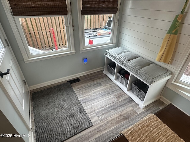 interior details with visible vents, baseboards, and wood finished floors