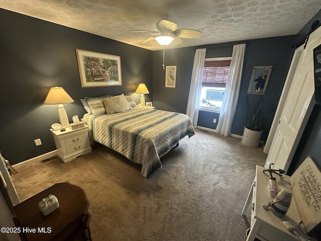 carpeted bedroom with ceiling fan, a textured ceiling, and baseboards