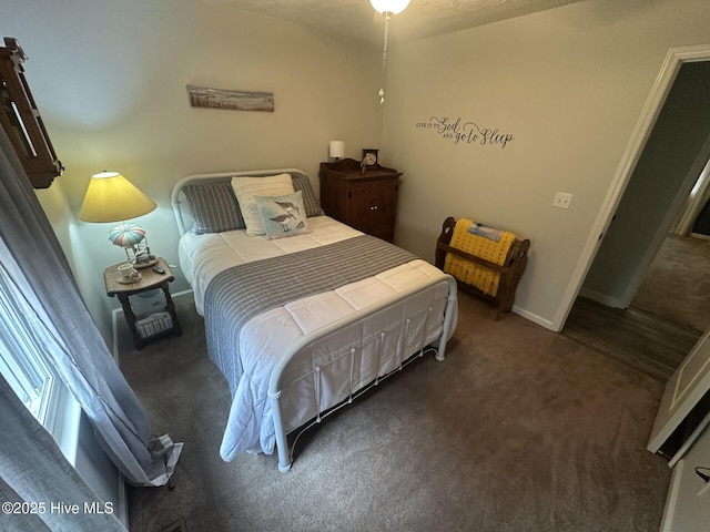 bedroom with carpet and baseboards