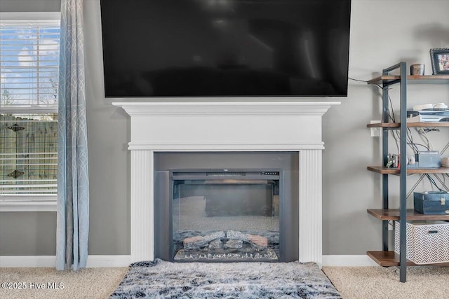 details with baseboards and a fireplace