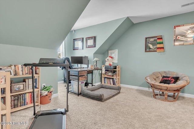 interior space with lofted ceiling, baseboards, and visible vents