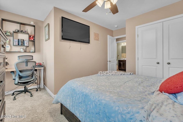 bedroom featuring a closet, baseboards, carpet, and a ceiling fan