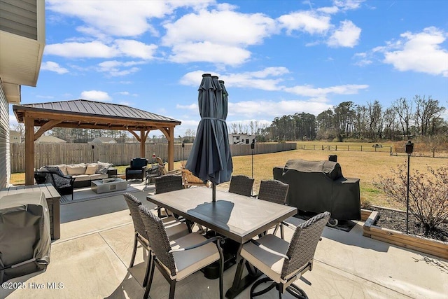 view of patio with a gazebo, an outdoor living space, outdoor dining area, and a fenced backyard