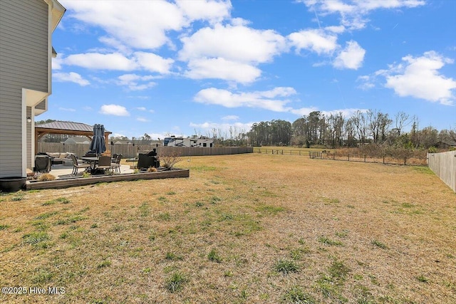 view of yard featuring a gazebo, a fenced backyard, and a patio area