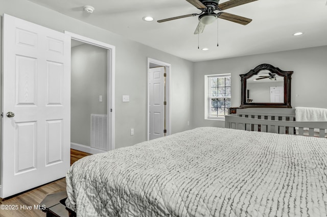 bedroom with recessed lighting, visible vents, dark wood-style flooring, and ceiling fan