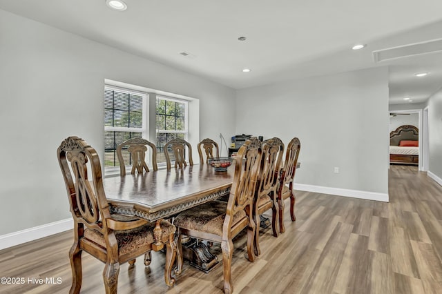 dining area with recessed lighting, wood finished floors, and baseboards